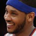 New York Knicks' Carmelo Anthony (7) reacts after hitting a 3-point shot against the Dallas Mavericks during the second half of an NBA basketball game