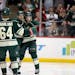 Minnesota's Zach Parise, center, celebrated his winning goal with teammates Mikael Granlund, left, and Jonas Brodin, right, during the third period as
