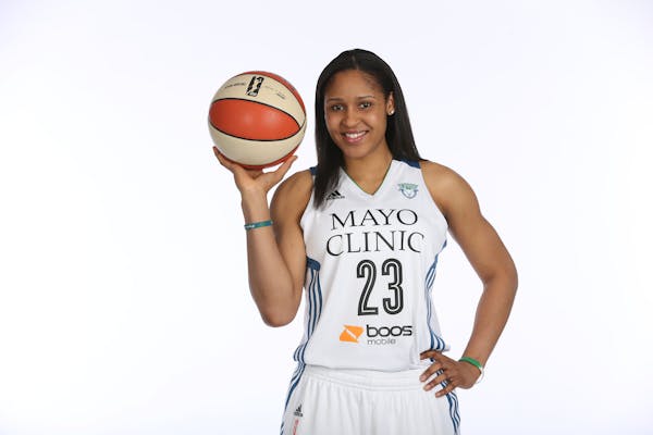 Maya Moore shows off the new look for the Lynx.