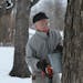 Roger Schmidt of Plymouth hung a bucket getting ready for the sugaring season. An avid tapper, he says he likes syrup on “just about anything,” ev