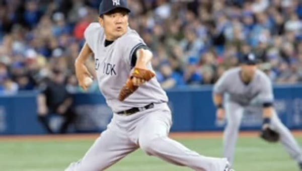Tanaka wins in MLB debut