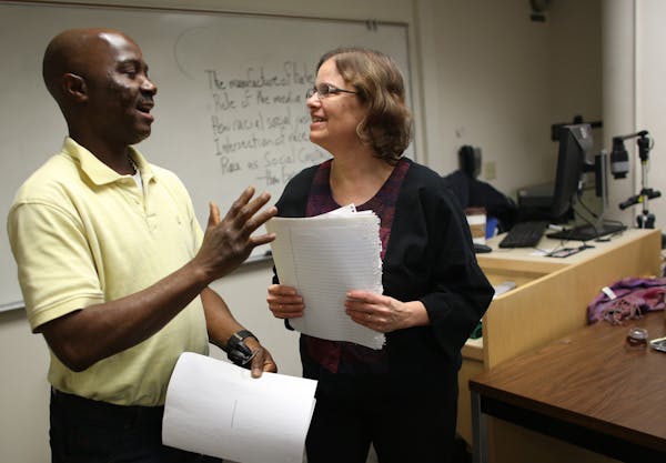 Student James David and Metro State University Prof. Anne Winkler-Morey talked about the assignment she had just handed back to him.