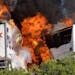 Massive flames are seen devouring a bus and a FedEx truck just after the crash in Calif. on Thursday April 10, 2014.