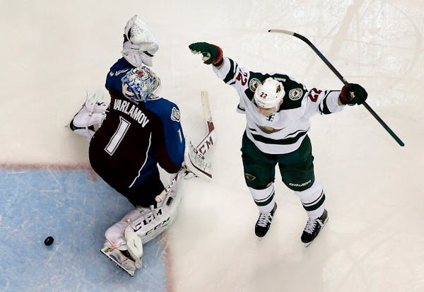 Nino Niederreiter celebrated after shooting the puck past Colorado goalie Semyon Varlamov to score the game winning goal in overtime.