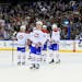Tampa Bay Lightning players skate off as the Montreal Canadiens celebrate a 5-4 overtime victory in Game 1 of the first round of the playoffs at the T