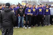 Player rebellion: Reinstated Minnesota State, Mankato football coach Todd Hoffner, in front, listened as football player Samuel Thompson, with the res