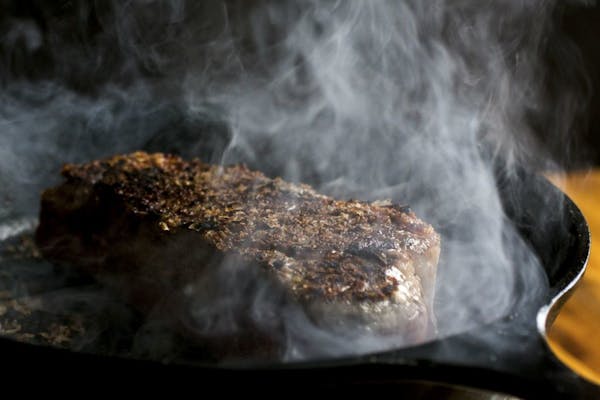 Searing with a cast-iron skillet is the only way to get a hot enough surface on a stovetop at home.
