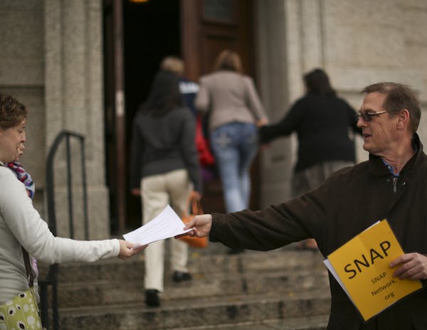 SNAP, the Survivors Network of those Abused by Priests offered leaflets on Sunday to churchgoers in St. Paul.