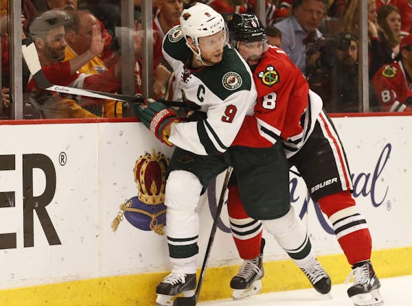 Wild captain Mikko Koivu, being checked by Chicago’s Nick Leddy in Game 5, has one point and is a minus-3 in the series but wouldn’t blame his str
