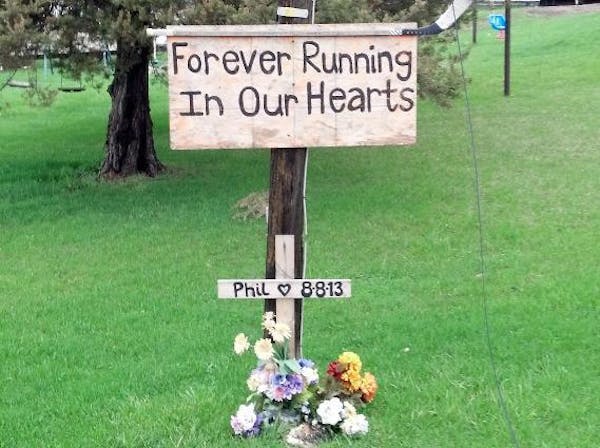 This memorial was still standing nine months after a van fatally hit 19-year-old Phillip LaVallee as he ran along a rural Wright County road.