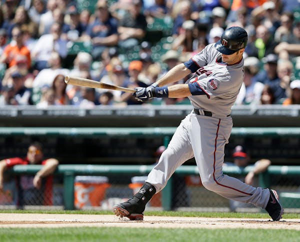Minnesota Twins' Joe Mauer bats during the first inning of a baseball game against the Detroit Tigers in Detroit, Saturday, May 10, 2014.