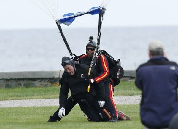 Bush 41 makes parachute jump on 90th birthday