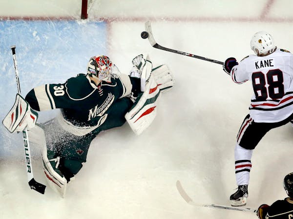 Patrick Kane shot the puck past Wild goalie Ilya Bryzgalov to beat the Wild 2-1 in overtime of Game 6. Chicago won the series 4-2.