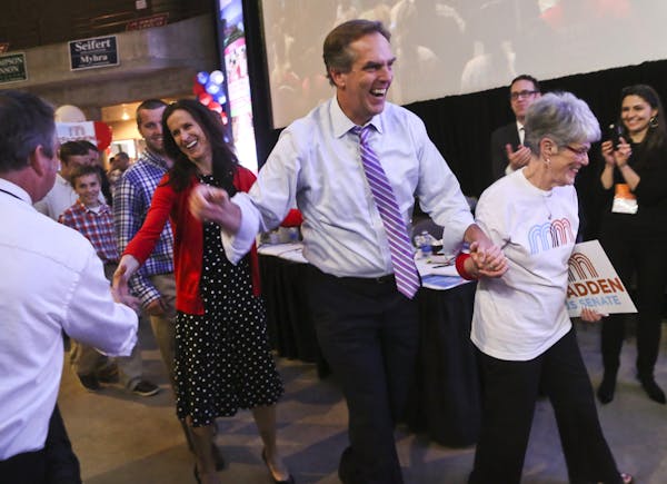 Mike McFadden walked to the podium Saturday with his mother, Mary Loretta, right, and his wife, Mary Kate, and children before receiving the party’s