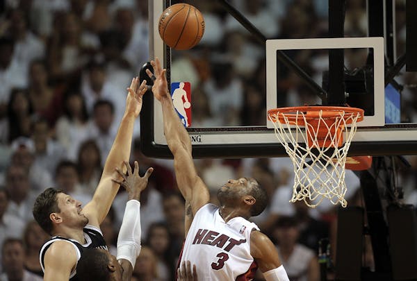 Heat, Spurs advance to conference finals