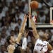 Miami Heat guard Dwyane Wade defends the shot of Brooklyn Nets forward Mirza Teletovic during the first half in Game 5 of the Eastern Conference semif