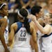 Minnesota Lynx guard Lindsay Whalen (13) congratulated center Janel McCarville (4) as she went to the line late in the fourth quarter Sunday evening. 