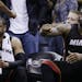 Miami Heat guard Dwyane Wade, left and forward LeBron James (6) sit on the bench in the final moments at Game 5 of the NBA basketball finals on Sunday