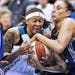 Lynx Seimone Augustus, left, was tied up by Phoenix Diana Taurasi for a jump ball as she drove to the basket.