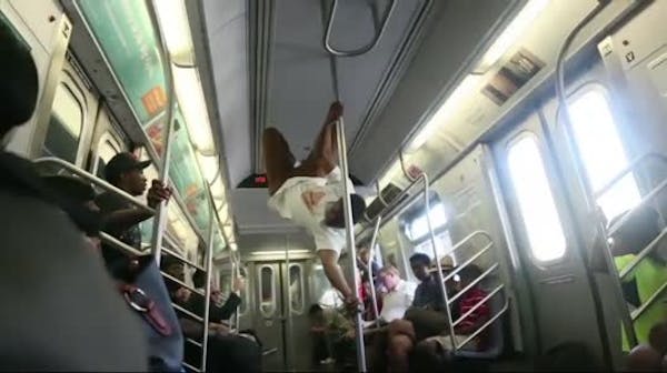 NYC police to subway acrobats: sit down