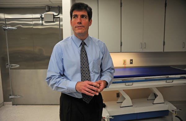 Dr. Andrew Baker, Hennepin County's medical examiner, shown in 2012.