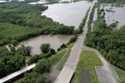 June 28: A section of Hwy. 101 was under water from the Minnesota River.