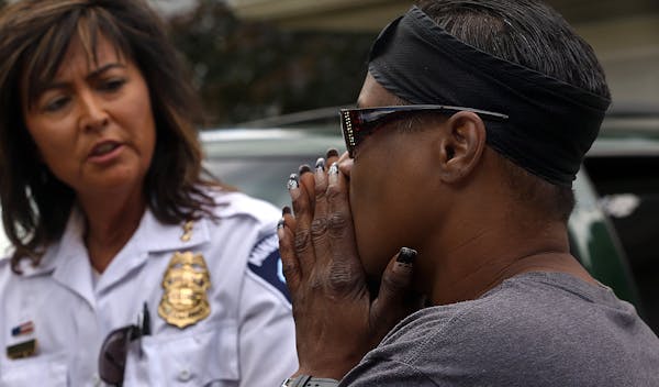 Chaujunha Dunigan, right, explained to Minneapolis Police Chief Janeé Harteau her concerns about violence in her neighborhood. “Sometimes I am afra