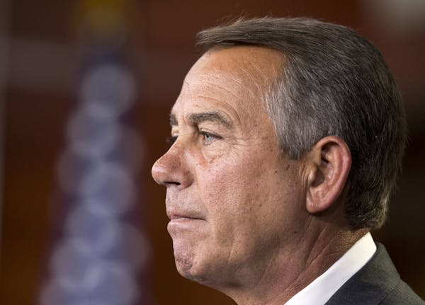 House Speaker John Boehner of Ohio, pauses as he speaks to reporters on Capitol Hill in Washington, Thursday, July 10, 2014, during a news conference.