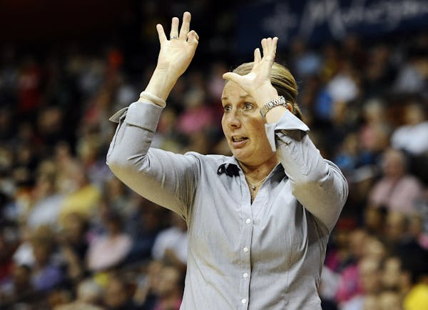 Minnesota Lynx head coach Cheryl Reeve gestures during the first half of a WNBA basketball game against the Connecticut Sun, Sunday, July 27, 2014, in