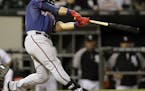 Minnesota Twins' Oswaldo Arcia (31) hits a two-run double during the eighth inning of a baseball game against the Chicago White Sox in Chicago, Saturd