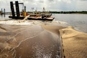 Three dredges have been employed to remove sediment in the Upper Mississippi in an effort to restore service to the navigation channel.