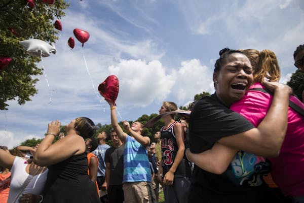 Kimberly Adama, mother of Sha-kim Adams, wept as a group of family and friends released balloons in the air in his memory during a memorial Thursday a