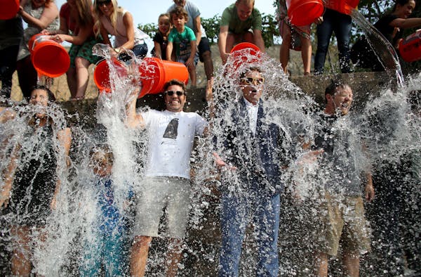 David Denim, president of space150 ad agency (in suit) and owner Billy Jurewicz (in white T-shirt) took the challenge Wednesday, along with employees 