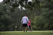 Jesse Dolinar and daughter Jordan practiced on the putting green at the Theodore Wirth Golf Course in Minneapolis. Young players and women are two gro