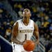 Michigan Wolverines forward Glenn Robinson III shoots against Wayne State in the first half of an exhibition NCAA basketball game in Ann Arbor, Mich.,