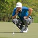 Nick Watney lines up a putt on the ninth hole during the third round of the Wyndham Championship golf tournament in Greensboro, N.C., Saturday, Aug. 1