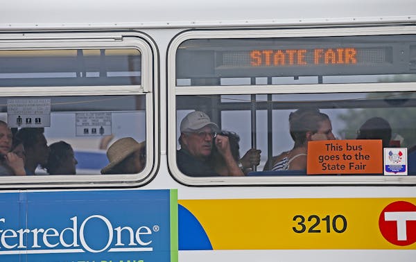 Fairgoers made their way to the new bus transportation hub at the Minnesota State Fair on Sunday in Falcon Heights.