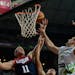 Mason Plumlee of the U.S, left, vies for the ball with Slovenia's Alen Omic during Basketball World Cup quarterfinal between Slovenia and United State