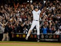 New York Yankees' Derek Jeter jumps after hitting the game-winning single against the Baltimore Orioles in the ninth inning of a baseball game, Thursd