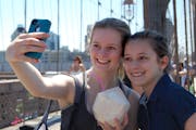 When traveling with teens, there must be selfies. Here, Anya (left) and Talia Magnuson of Minneapolis stop for a quick snapshot on while walking the B