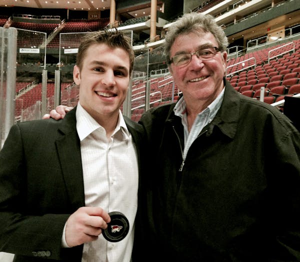 Zach Parise, left, and his father, J.P. Parise, in a photo taken last year in Phoenix when Zach passed his father on the all-time goal-scoring list. I
