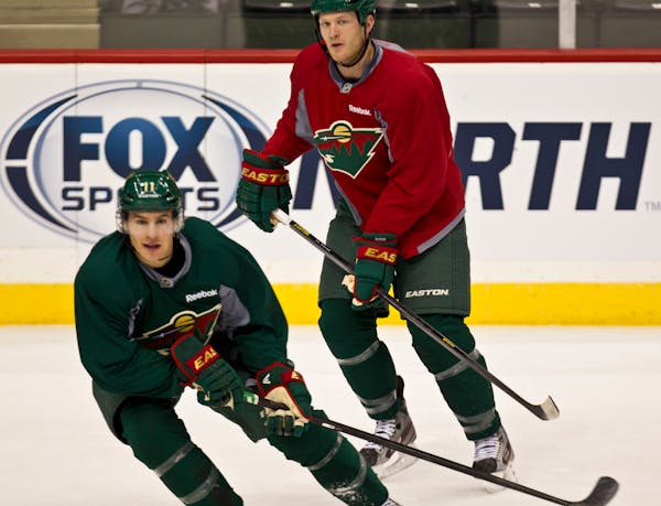 Zach Parise (11) and Ryan Suter (20) during Wild hockey practice on January 18, 2013, in St. Paul