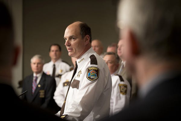 Hennepin County Sheriff Rich Stanek, center, in January 2013 at the State Capitol.