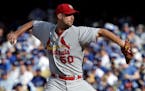 St. Louis Cardinals starting pitcher Adam Wainwright throws against the Los Angeles Dodgers during the second inning in Game 1 of baseball's NL Divisi
