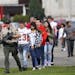Students are escorted to buses for evacuation after a shooting at Marysville Pilchuck High School, in Marysville, Wash., Oct. 24, 2014. (Mark Harrison