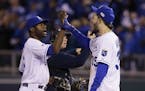 Kansas City Royals Lorenzo Cain, left, celebrates with Eric Hosmer after Game 6 of baseball's World Series against the San Francisco Giants Tuesday, O