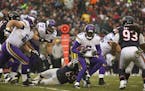 Minnesota Vikings quarterback Teddy Bridgewater (5) was pressured by Chicago Bears defensive end Jared Allen (69), but gained two yards while scrambli