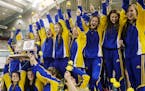 The Wayzata High girls won the MSHL girls' team swimming state finals in Class 2A and celebrated with their trophy Friday, Nov. 11, 2014, at the Unive