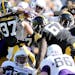 Defensive backs Desmond King (14) and John Lowdermilk (37) and the rest of the Iowa defense stopped Northwestern’s Justin Jackson as he tried to jum