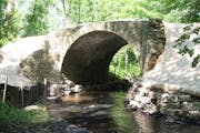 The Point Douglas-St. Louis River Road Bridge near Stillwater was built in 1863 from locally quarried limestone rock. The bridge once carried part of 